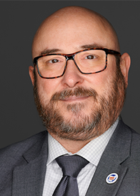 Dennis Lowe, man with beard, glasses, bald